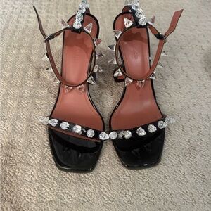 Amina Muaddi Black Heels with Silver Accents